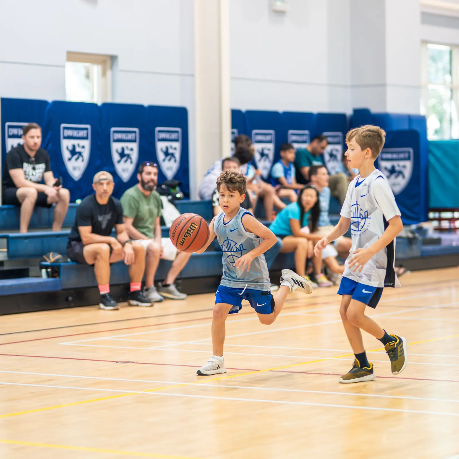 Young Dubai Hoop School players in a basketball game